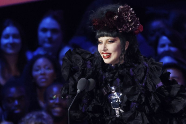 Lady Gaga accepts the 