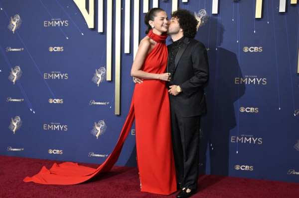 Selena Gomez gets a kiss from Benny Blanco as they arrive for the Primetime Emmy Awards Sunday. Photo by John McCoy/UPI