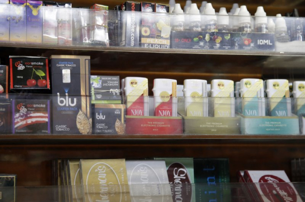 E-cigarettes and other tobacco products are pictured on display in a New York store in 2014. On Tuesday, the FDA recommended that manufacturers of nicotine pouches use child-resistant packaging. File Photo by John Angelillo/UPI
