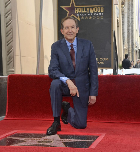 Chris Wallace kneels next to his star during an unveiling ceremony honoring him with the 2,820th star on the Hollywood Walk of Fame in Los Angeles on September 18. The correspondent turns 78 on October 12. Photo by Jim Ruymen/UPI