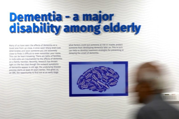 At an awareness seminar on World Alzheimer's Day in Bangalore, India, in 2024, a participant walks past. On Wednesday, University College London medical researchers announced what they say is the world's first successful treatment for Huntington's disease, which causes dementia. File Photo by Jagadeesh Nv/EPA
