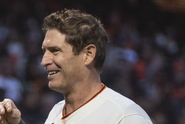 San Francisco 49ers great Steve Young whips up the San Francisco Giants fans before Game 1 of the National League Division Series against the Los Angeles Dodgers at Oracle Park in San Francisco on October 8, 2021. The hall of famer turns 64 on October 11. File Photo by Terry Schmitt/UPI