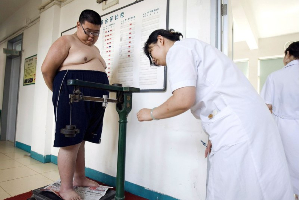 A new definition of obesity endorsed by 76 health organizations could dramatically increase the number of Americans considered obese, researchers said. File Photo by Diego Azubel/EPA