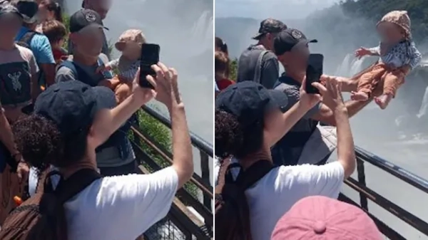 На фото зображено чоловіка, який тримає немовля на руках біля гори Диявола, водоспади Ігуасу, Аргентина, 17 лютого 2026 року.